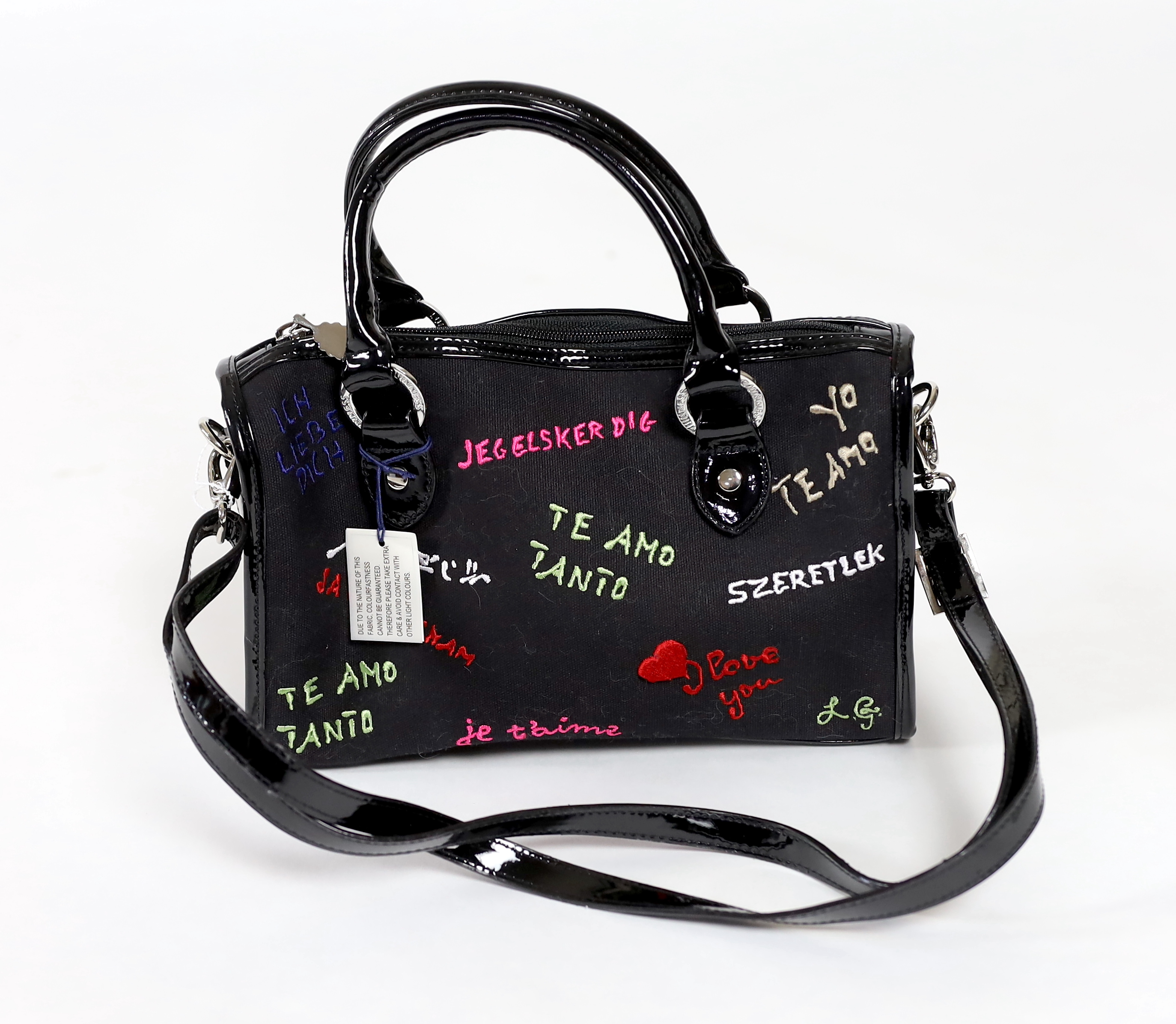 A Lulu Guinness vintage 'Keira' Love Graffiti embroidered canvas bag, unused with lilac dust bag, height 18cm, to handle 25cm, width 27cm, depth 9cm